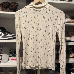 Cream Turtleneck Long-Sleeve Top with Ski Tree Print